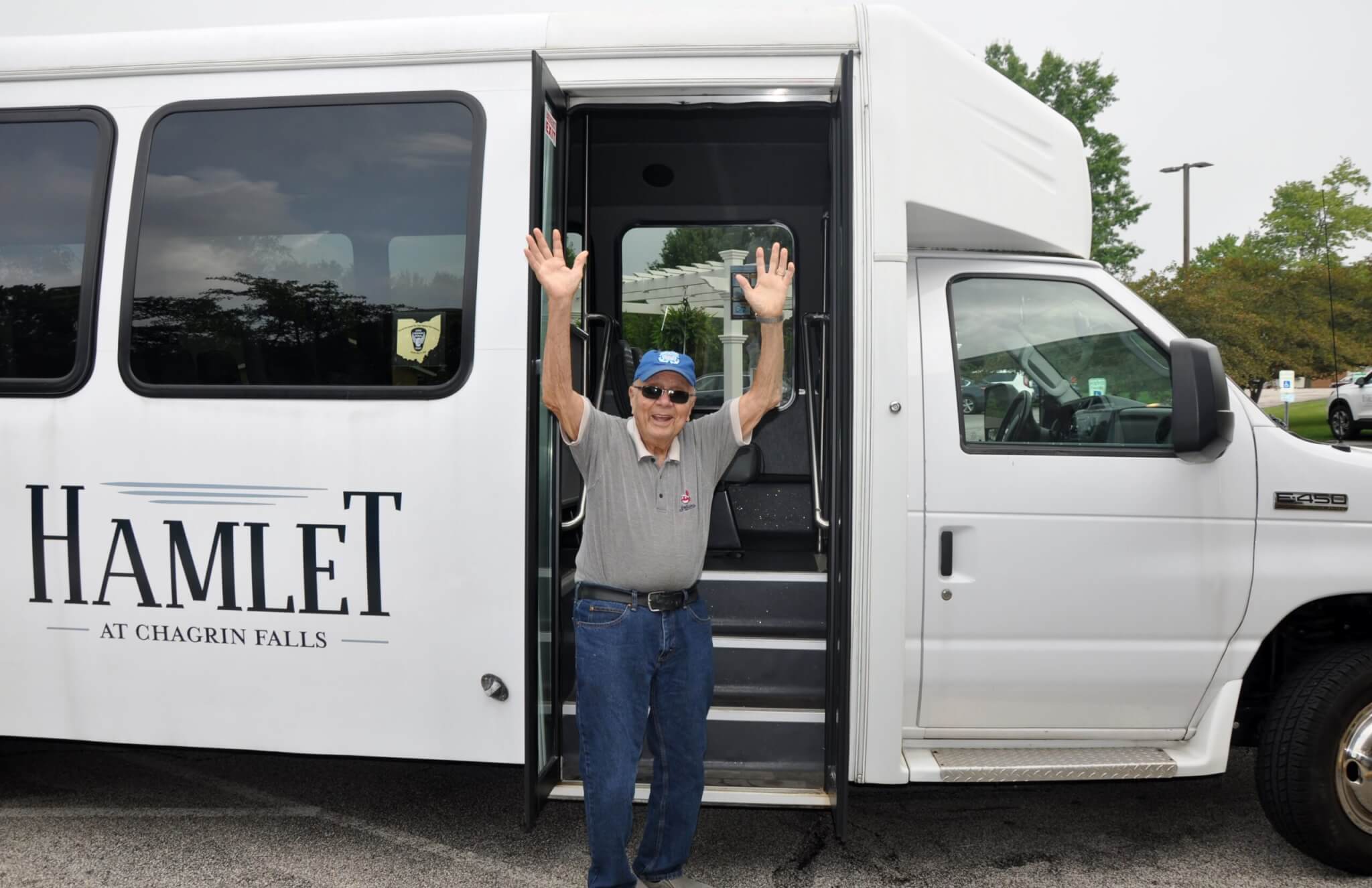 man with hands up next to transportation van 3