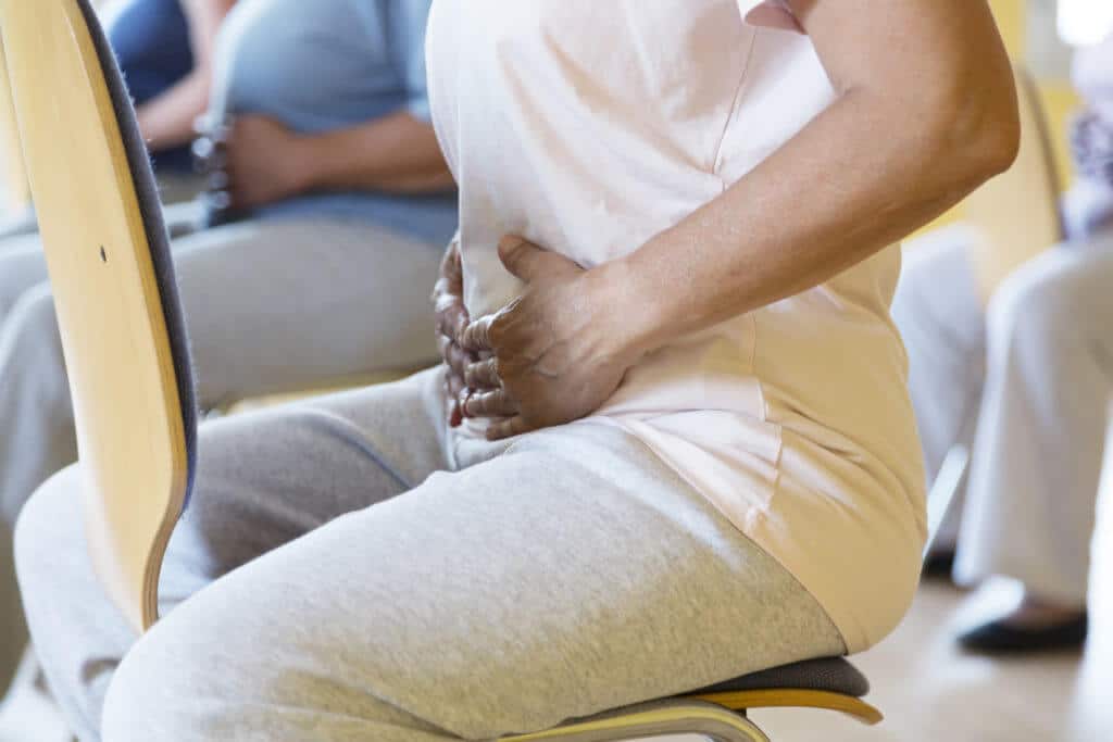 woman doing chair yoga