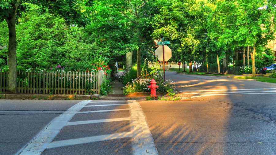 A photo of a crosswalk at a street of charming homes in the small town of Chagrin Falls